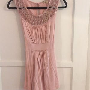 Pink tank top with chain and cutout design